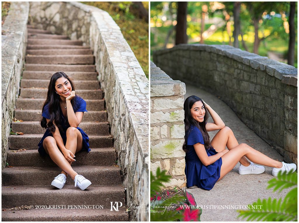 senior girl in blue dress sitting on stone bridge in Dallas, Texas